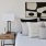 A bedroom with a bed and a night stand