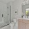Bathroom with a walk-in shower and large mirror