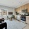 Kitchen and living area with a large window