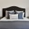 Bedroom with a a bed and night stands on each side
