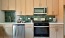 Kitchen with beige cabinets